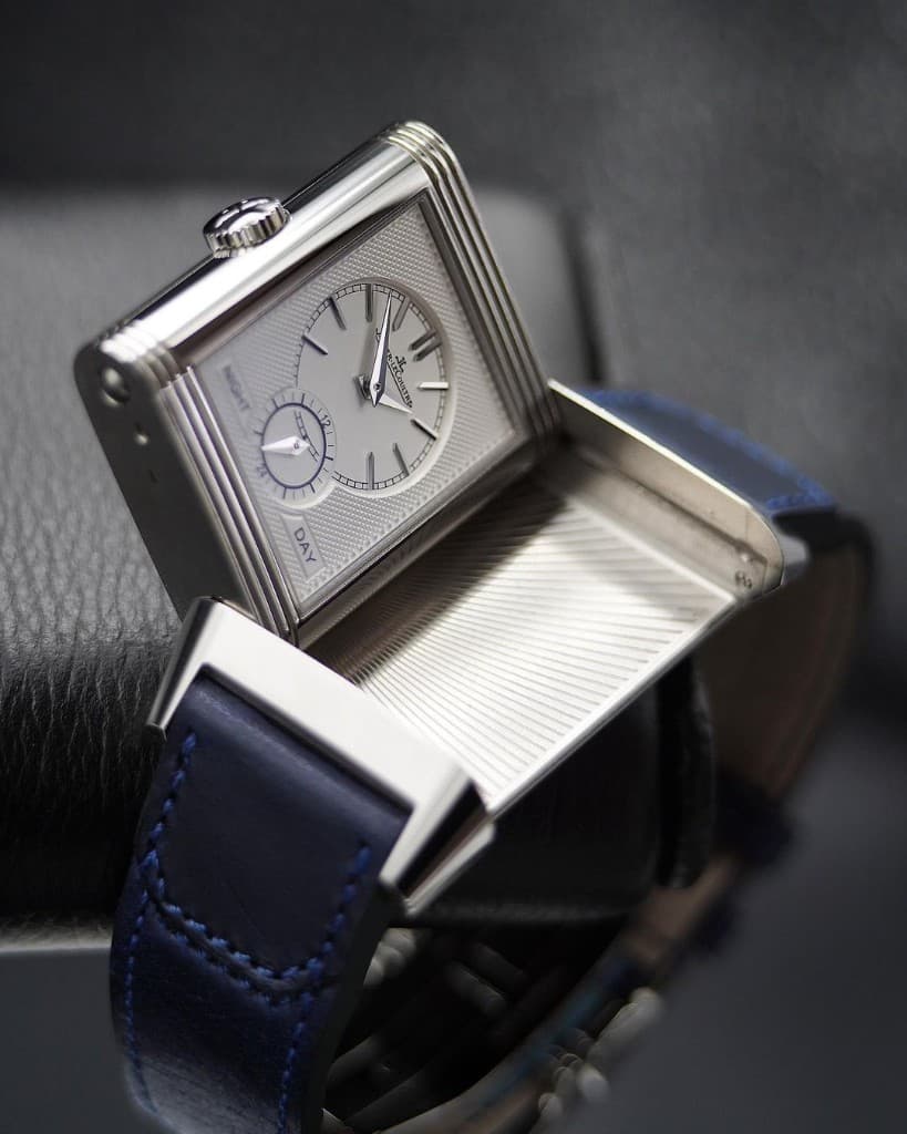 A Jaeger-LeCoultre Reverso with the case flipped open, showing the steel back